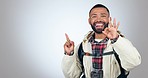 Face, hand pointing and perfect sign by man in studio hiking, travel or review and feedback success on grey background. Adventure, portrait and guy backpacker with yes emoji, agree or promo support