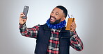 Selfie, celebration or happy man with passport for travel opportunity, holiday or vacation in studio. Smile, vlogging or excited person with flight ticket to post on social media on white background