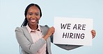 Happy black woman, poster and hiring sign for opportunity or recruitment against a studio background. Portrait of African female person, business or employer with billboard for company growth or job
