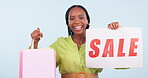 Woman, sale sign and shopping bag for discount, fashion deal and retail promotion or e commerce in studio. Excited face of african customer or seller dance for marketing poster on a white background