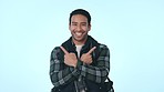 Pointing, man and face to mockup for marketing, announcement and choice. Advertising decision, male person portrait and happy from promo and offer in studio with blue background and excited model