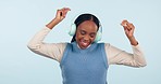 Woman, dancing and headphones in studio to celebrate freedom, party and excited for audio on white background. Happy african model with energy listening to hip hop music, sound and radio subscription