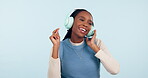 Black woman, dance and music headphones in studio for celebration of freedom, party or hearing audio song on white background. Happy model listening to multimedia podcast, sound or radio subscription