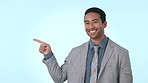 Happy businessman, pointing and list on mockup space for advertising against a studio background. Portrait of asian man or employee with smile and showing business deal, sale or discount in marketing