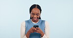 Woman, smile and typing on smartphone in studio, reading social media and funny multimedia notification on white background. Cellphone, african model and search meme, download app and laugh for chat