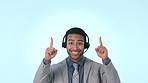 Happy businessman, call center and pointing up in customer service against a studio background. Asian man, consultant or agent smile with headphones and showing notification or alert on mockup space