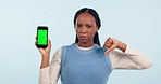 Black woman, phone and thumbs down for bad review or no against a studio background. Portrait of African female person with mobile smartphone display, green screen or negative feedback on mockup