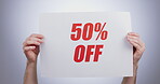 Hands, discount percentage and advertising sign at studio isolated on a white background. Poster, sales deal and special offer of price reduction, clearance promotion and marketing savings in retail