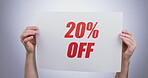 Hands, discount rate and promotion sign at studio isolated on a white background. Poster, sales deal and special offer of price reduction, clearance advertising and marketing savings in retail shop