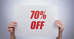 Discount sign, hands with offer and opportunity for shopping, poster and advertising on white background. Store sale, communication and promotion, person with billboard for deal for service in studio