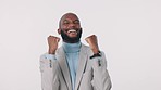 Winner, success and promotion with a business man in studio on white background for celebration. Bonus, smile or motivation and a happy employee cheering with energy for the achievement of a goal