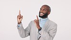 Business advertising, happy and black man pointing up at sales launch news, job announcement or opportunity promo. Studio ads logo, info commercial and African person presentation on white background