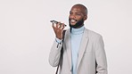 Business, black man and voice chat on smartphone in studio isolated on a white background mockup space. Phone call, recording audio and professional on loudspeaker, ai assistant and communication