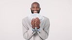Money, financial and a man lottery winner in studio on white background with cash bonus or salary increase. Portrait, smile and business with a happy employee excited by finance or investment success