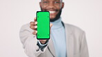 Phone, black man and green screen in studio for marketing and advertising with smile and mockup space. Professional person, smartphone and tracking marker for display and product placement for app