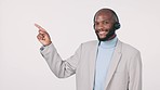 Black man, call center and pointing in contact us, advertising or list against a studio background. Happy African male person, consultant or agent showing steps for customer service on mockup space