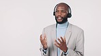 Black man, call center and consulting with headphones in customer service against a studio background. African male person, consultant or agent talking in online advice or telemarketing on mockup
