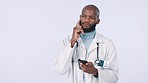 Healthcare, phone and a man doctor thinking on a white background in studio for diagnosis research. Medical, contact and text message with a young medicine professional using a mobile for networking