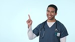 Happy asian man, doctor and pointing to list in choice, decision or option against a studio background. Portrait of male person, medical or healthcare nurse showing steps, select or process on mockup