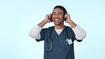 Happy, music and a man or doctor on a studio background for relax, sound and break from healthcare. Smile, podcast and an Asian nurse or medical employee listening to audio on headphones with sound