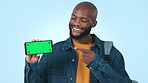 Green screen, pointing and man with phone in studio with mockup for advertising or marketing. Smile, tracking markers and portrait of African person with cellphone and approval or ok hand gesture.