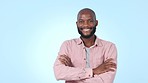 Face, fashion and black man with with arms crossed, smile and aesthetic on a blue studio background. Portrait, African person and model with stylish outfit, cheerful and casual with cool clothes