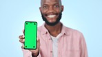 Green screen, closeup and man with phone in studio with mockup for advertising or marketing. Chroma key, tracking markers and young African person with cellphone for mock up space for promotion.