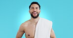 Body, hygiene and a man with a towel in studio isolated on a blue background for skin care. Portrait, natural beauty and model grooming for facial cosmetics, dermatology and healthy spa treatment
