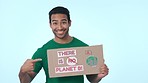 Climate change, poster for recycling and a volunteer man on a blue background in studio to promote conservation on earth day. Portrait, smile and charity for global warming or green sustainability