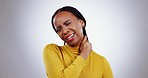 Neck, pain and woman in studio with stress, joint inflammation and arthritis risk on grey background. Sick african model, injury and massage muscle for first aid, emergency or frustrated with fatigue