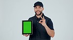 Delivery man, tablet and green screen with logistics and success with menu, option or pointing to services and supply chain. Mobile app, ux or portrait of courier with ecommerce, tech and shipping ui