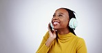 Music headphones, smile and black woman dance in studio isolated on white background. Radio, streaming and happy African person moving to audio, listening to sound and hearing podcast on mockup space