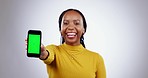 Woman, offer and phone green screen for marketing mockup, presentation or happy news in studio. Face of african person with mobile app or design for opportunity, tracking marker and white background