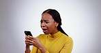 Stress, phone and face of black woman in studio with wtf, fake news or why on grey background. Smartphone, anxiety and lady model with 404, glitch or phishing, scam or social media, hacker or mistake