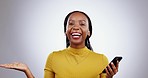 Phone, face and black woman with hand pointing in studio for news, social media or about us on grey background. Smartphone, portrait and African female model show app, review or feedback presentation