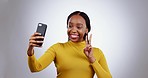 Selfie, face and black woman in studio with peace, hands or gesture for profile picture on grey background. smartphone, photography and African lady influencer smile for social media, blog or podcast