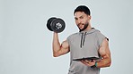 Dumbbell, exercise and a man with clipboard in studio for workout plan or membership. Portrait of personal trainer person with paper or form for fitness sign up, gym subscription and white background
