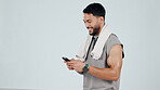 Happy man, phone and typing in fitness, communication or social media against a studio background. Male person smile for online search, chatting or texting on mobile smartphone app on mockup space