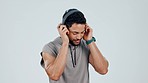 Athlete, dance and listening to music with headphones in studio with happiness, wellness and health on white background. Gen z, man and audio tech, streaming and workout in sport with hip hop radio