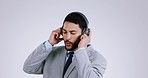 Business man, dancing and headphones in studio, smile and listening to music by white background. Entrepreneur, happy dancer and audio streaming subscription with sound tech, freedom and inspiration