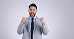 Winner, fist pump and face of business man in studio for celebration of bonus, payment and deal. Success, excited and portrait of person cheer for winning, promotion and lottery on gray background