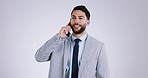 Happy business man, phone call and studio with talking, networking or agreement by white background. Entrepreneur, smartphone conversation and negotiation for deal, contact or sales lead with smile