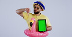 Green screen, tablet and unhappy man thumbs down sign for travel review isolated in studio gray background. Bad, no and disappointed person in inflatable summer costume as marketing service or app