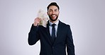 Winner, money and business man in studio for payment bonus, competition or lottery. Success, finance and portrait of worker on gray background with cash fan for promotion, stock trading or investment