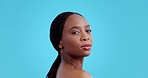 Skincare, beauty and face of black woman on blue background with cosmetics, makeup and glow. Dermatology, salon mockup and portrait of African person for wellness, healthy skin and glamour in studio