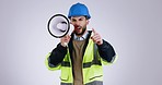 Megaphone, construction worker and protest portrait with speaker and attention in studio. Engineer, angry man and architect with builder speech and talking for warning with grey background and job