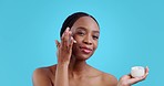 African woman, skincare cream and studio, beauty or product for health with thinking by blue background. Girl, model or smile with transformation, glow or cosmetic change with self care for wellness