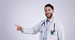 Man, face and doctor in studio pointing to advertising, process and healthcare checklist on mockup white background. Portrait of happy arab surgeon show steps, announcement and medical information 