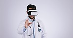 Doctor man, virtual reality glasses and studio for hands, health and test ux for futuristic tech by white background. Medic, ar vision and typing for healthcare, wellness and innovation in metaverse