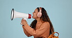 Megaphone announcement, student and angry woman protest for democracy vote, justice or human rights rally. Racism speech, microphone noise and studio speaker shout politics opinion on blue background